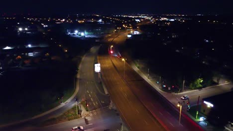 emergency vehicles on duty driving at night in longueuil, quebec. aerial