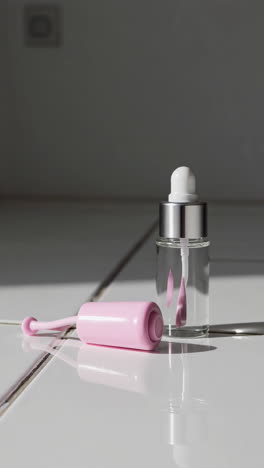 pink beauty serum and applicator