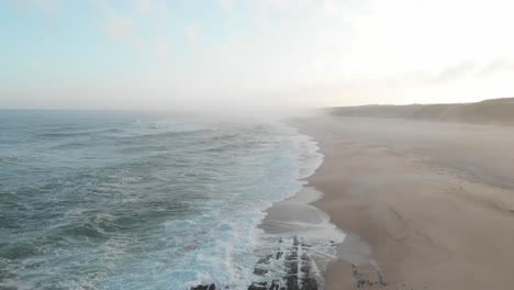 Early-morning-sunrise-on-a-lonely-beach-in-Portugal