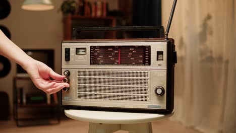 hand adjusting vintage radio