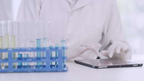 scientist checking monkeypox test tube samples