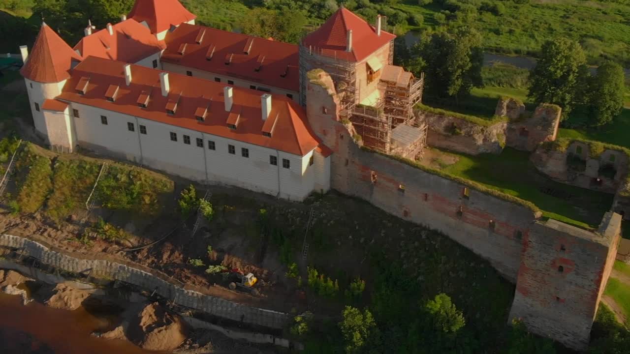 Orbit Shot Of Bauska Castle Reconstruction And Renovation In Rural Area, Zemgale