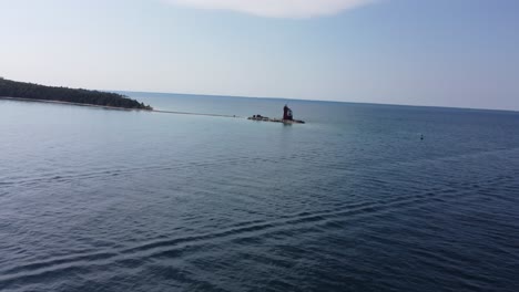 Aerial-shot-of-lone-house-on-lake