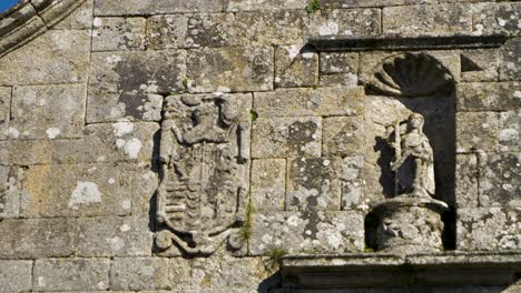 Pan-across-carved-effigy-in-recessed-area-allowing-for-people-to-worship-and-reflect