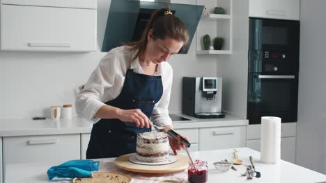 woman making chocolate cake in kitchen, close-up. cake making process, selective focus