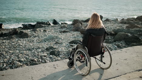 woman in wheelchair at the beach