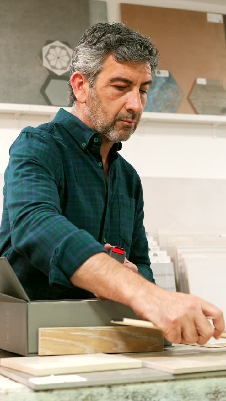 Man Examining Tile Samples