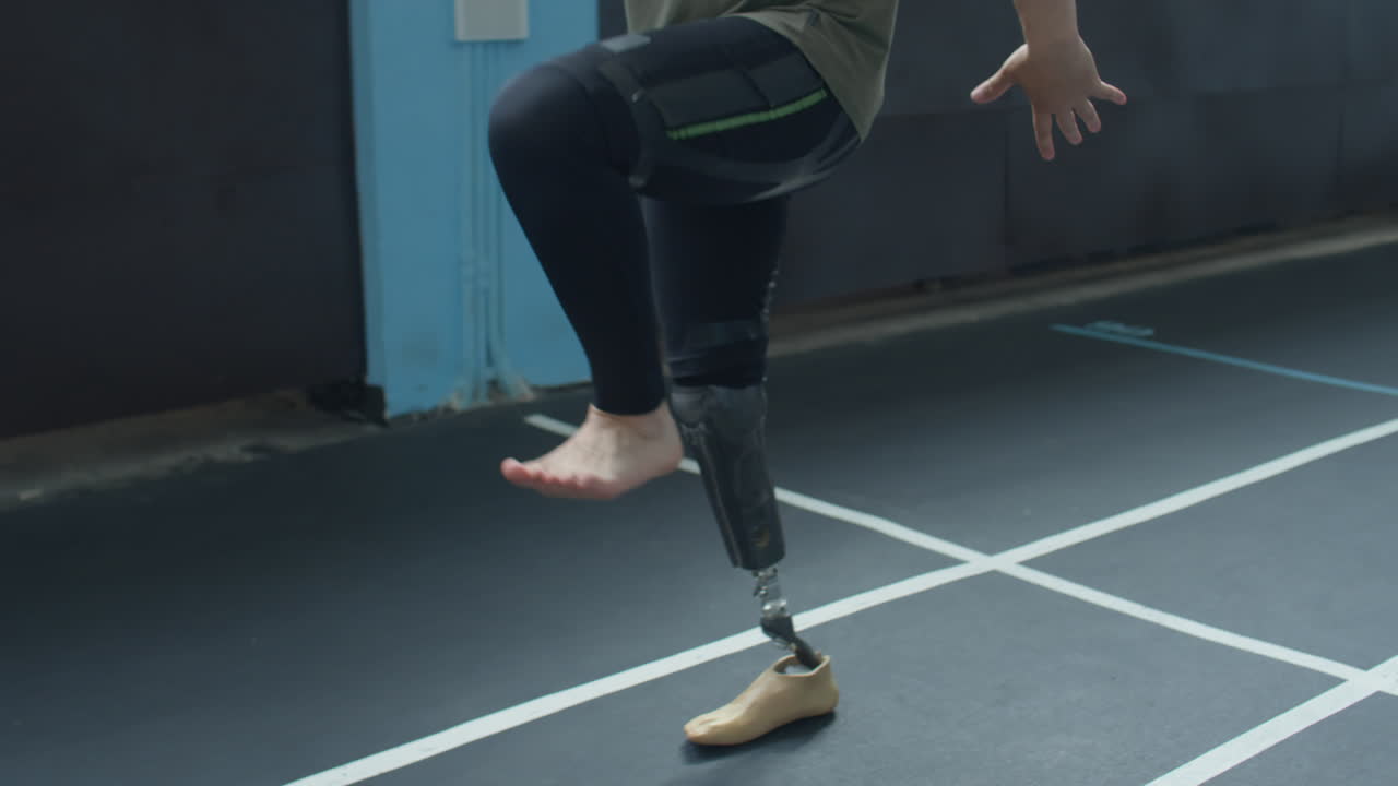 Man with Prosthetic Leg Doing High Knee Walk