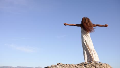 a woman's journey of serenity and freedom on a hilltop
