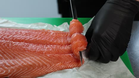 chef preparing raw salmon