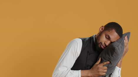 professional fatigued waiter takes a nap on his pillow after night shift