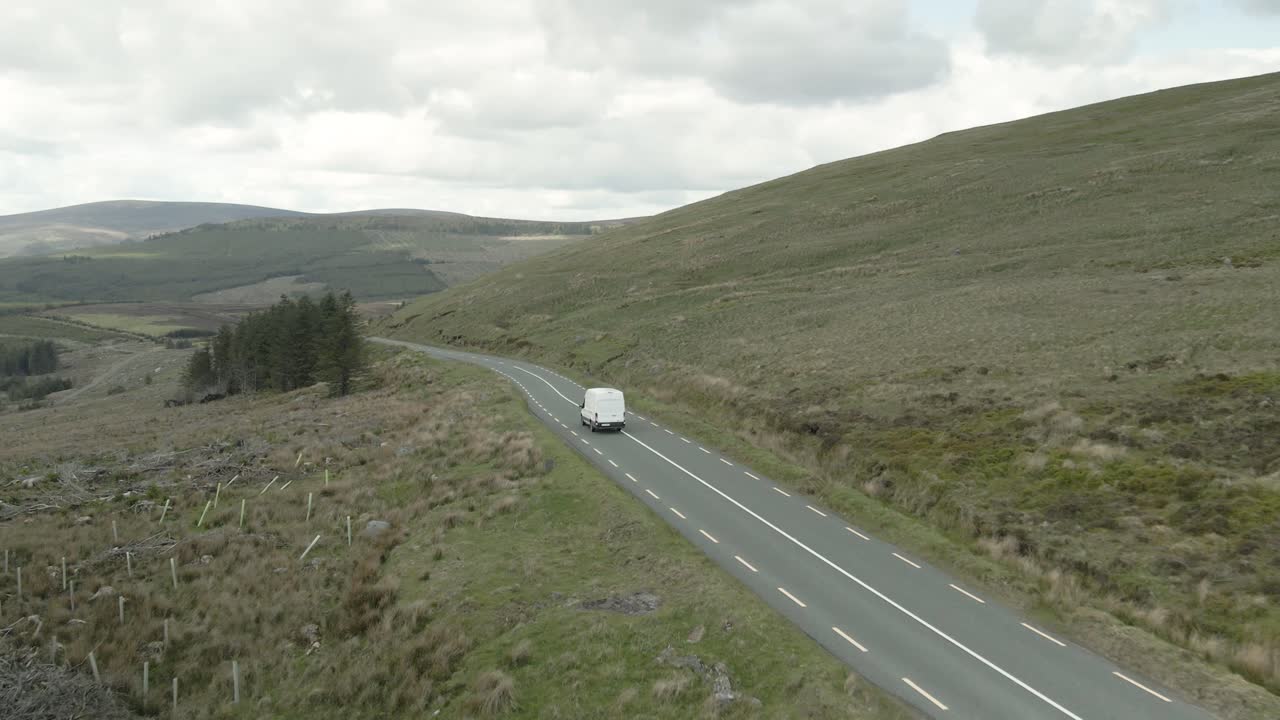 Aerial View Of White Delivery Van Traveling On An Empty Road Along The Wicklow Mountains In Ireland
