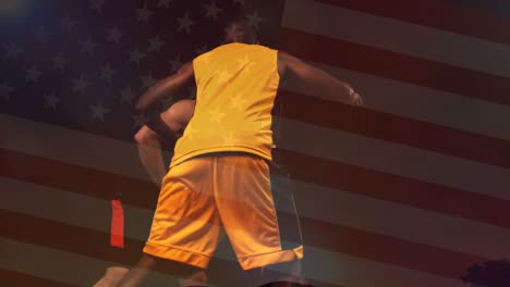 animation of flag of america and multiracial male opponent players playing basketball in court