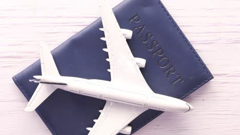 passport and airplane model: travel and vacation concept