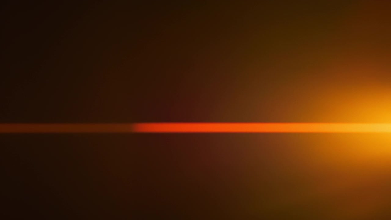 Golden and red anamorphic lens flares with horizontal light leaks