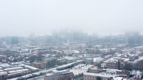 Aerial-drone-shot-towards-London-City-centre-on-a-snow-day-January-2021