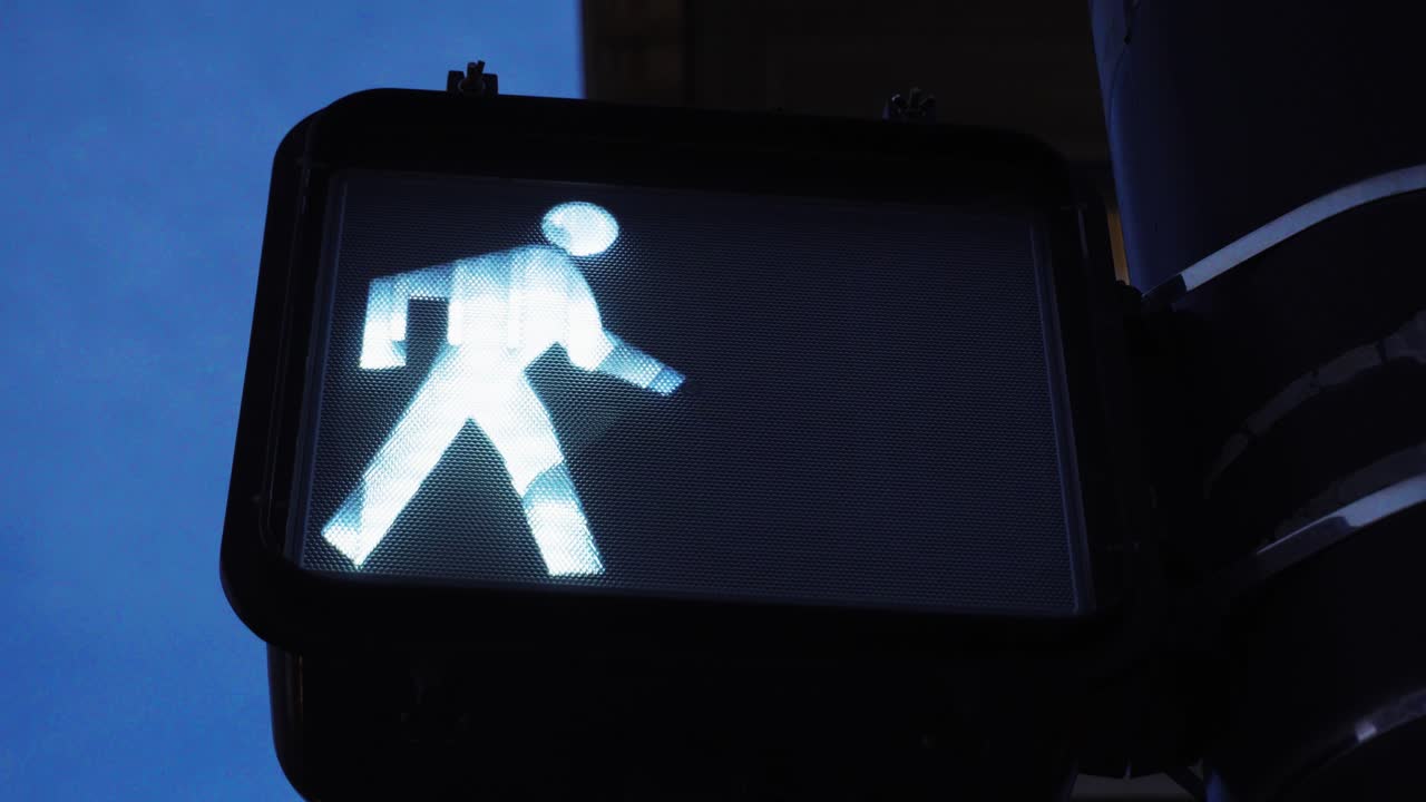 Crosswalk walking sign is on