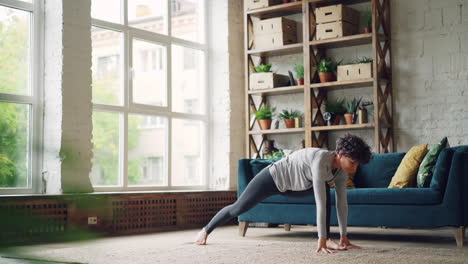 woman practicing yoga at home