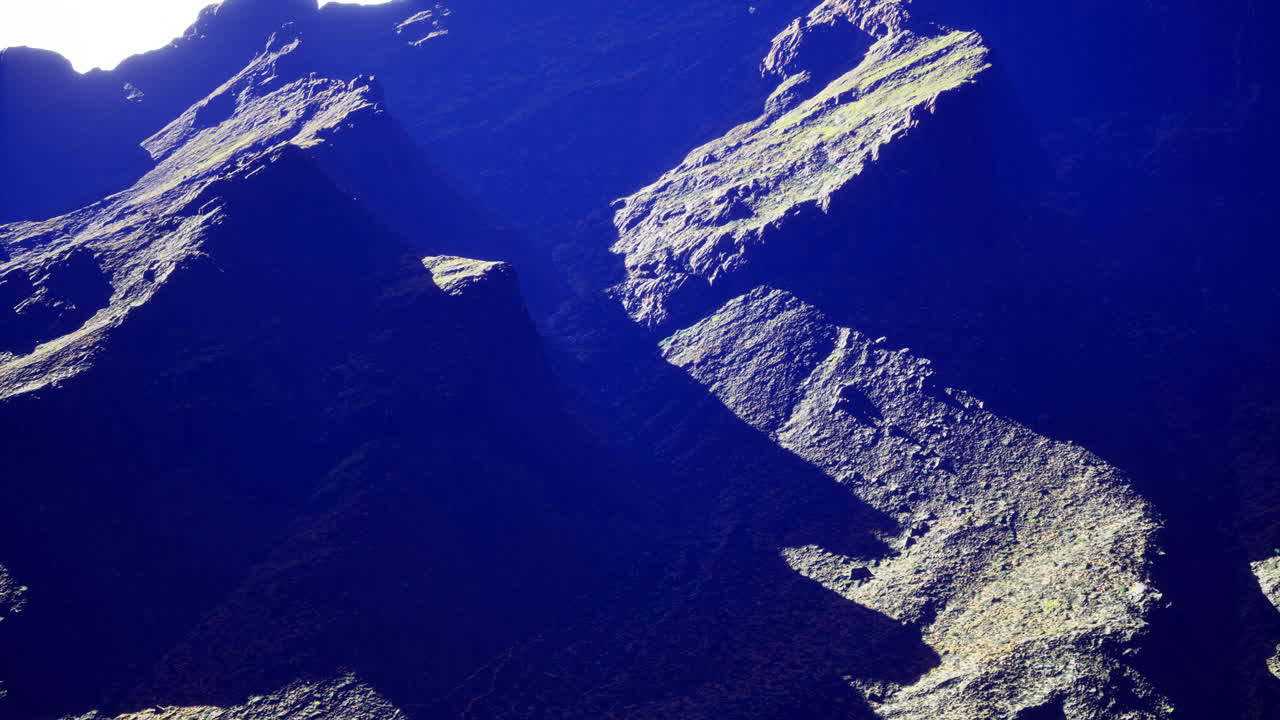 Rocky landscape with deep shadows captured in natural light at midday