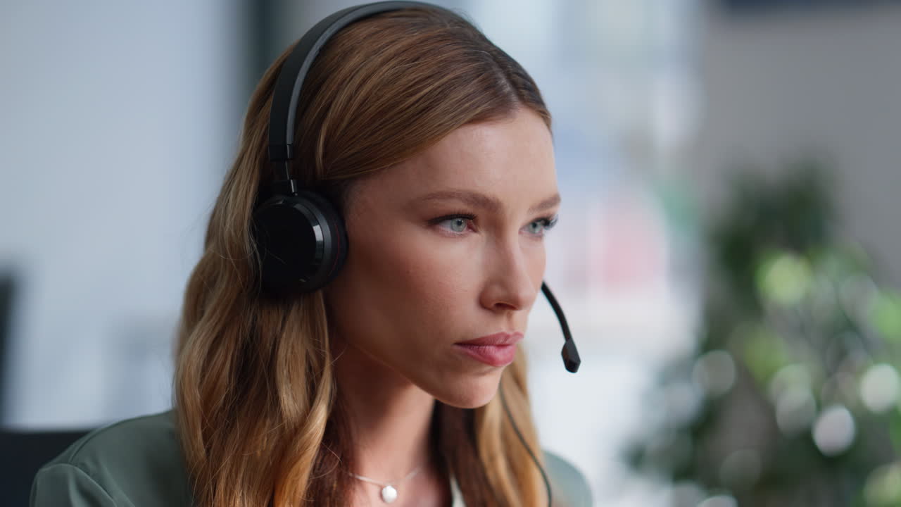 Call center worker wearing headphones start work at office interior closeup