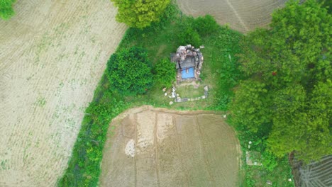 Aerial-Drone-shot-of-an-Ancient-Hindu-Shiv-Temple-of-Gurjara-Pratihara-era-in-a-village-of-central-India-near-Gwalior-in-Madhya-Pradesh