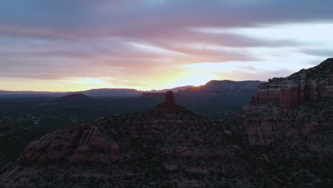 panorama of red rock buttes, mountains, and suburbs during dusk in sedona, arizona, usa