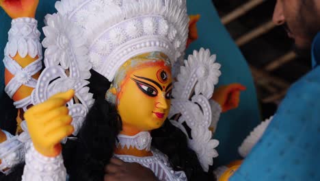 in kumortuli, idol artists are making idols of durga, the revered deity of hinduism. the work of making these idols starts from june and these potters make many idols till november.