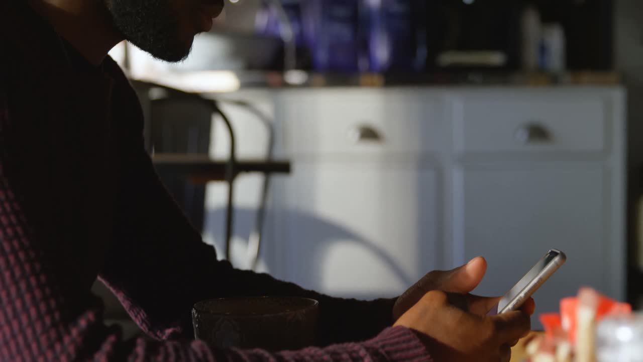 Man using mobile phone in cafe 4k