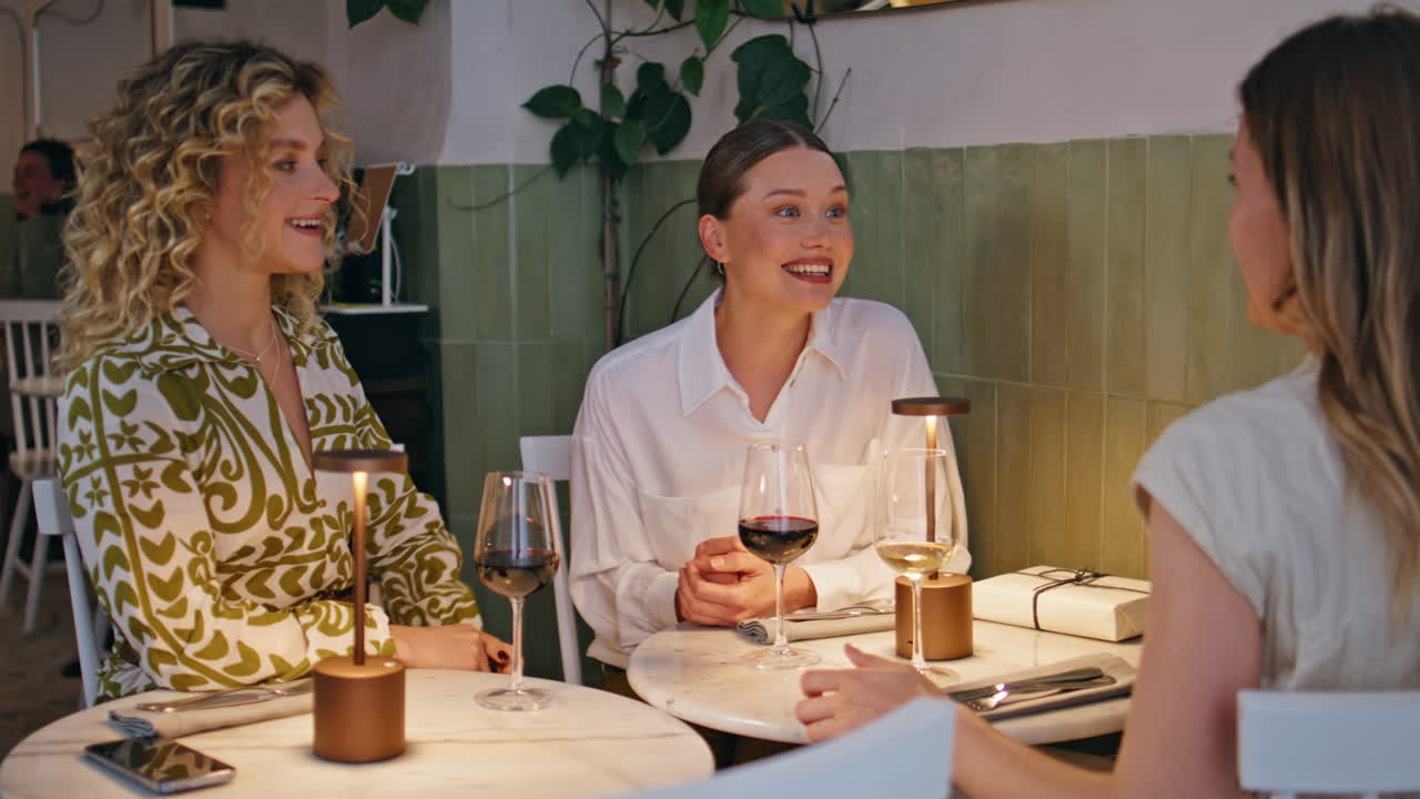 Friendly group talking cafe table enjoying joyful friendship moment closeup