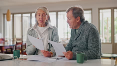 Senior-couple,-documents-and-stress-for-home-debt