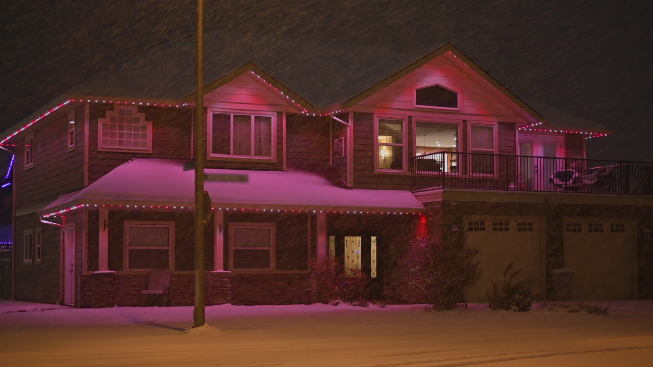 Suburban Delight: Winter Decor and purple Christmas Lights Transforming Snowy Homes