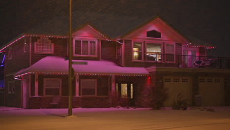 suburban delight: winter decor and purple christmas lights transforming snowy homes