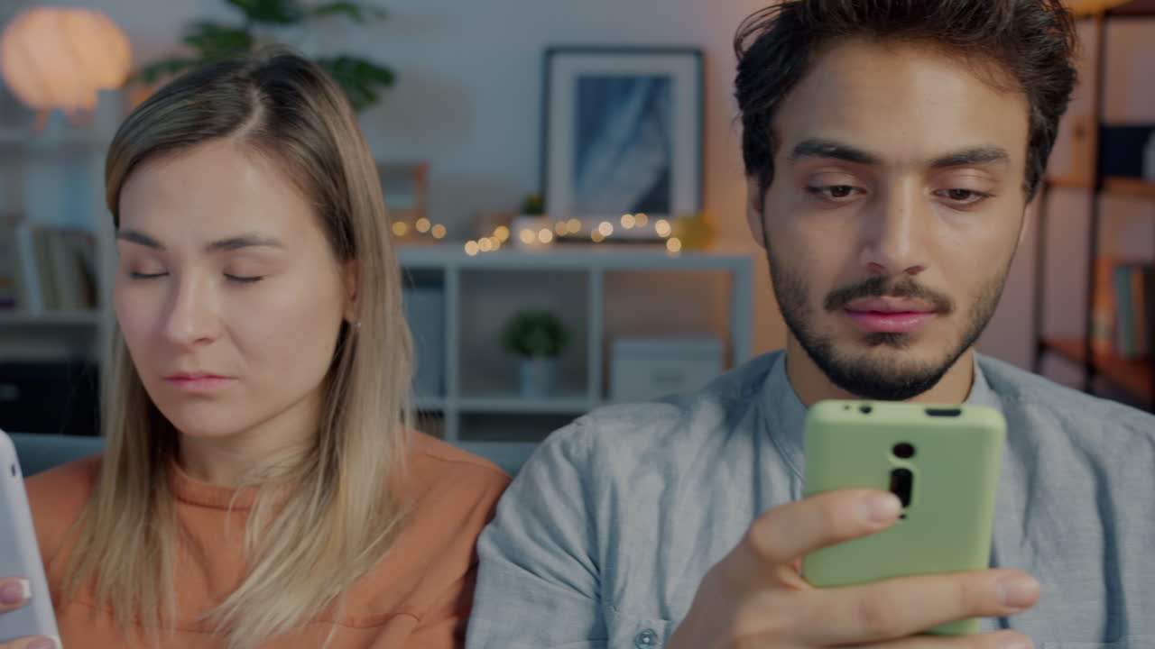 Couple Looking at Smartphones