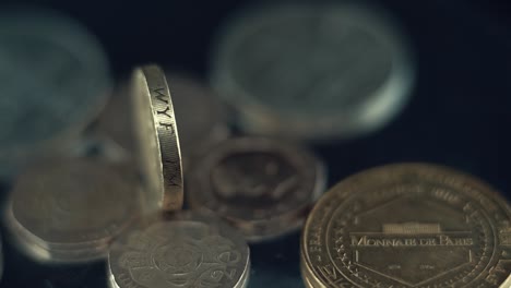 macro video of vintage rare coins, retro money edition, old gold, on a 360 rotating stand, 120 fps slow motion, static shot
