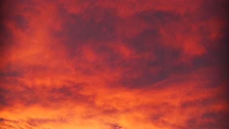 Colourful-warm-sunrise-or-sunset-clouds-in-the-city-during-the-fall-in-October-in-Calgary,-Alberta,-Canada