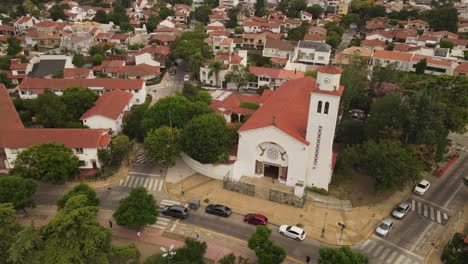 Aerial-establishing-shot-of-San-Juan-Bautista-Church-in-Buenos-Aires-during-cloudy-day