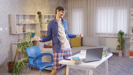 Male-student-dancing-at-home-and-enjoying-life.