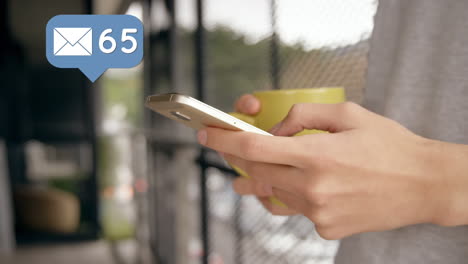 woman using a mobile phone and a message bubble icon