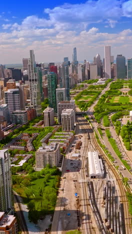 unbelievable scenery of modern and beautiful chicago. architecture, green park, stadium locating on the lake waterfront. vertical video
