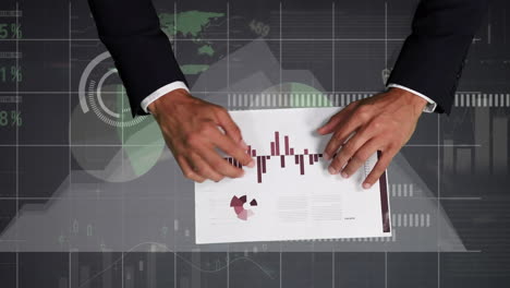 animation of digital screen with diverse data and graphs over hand of caucasian businessman