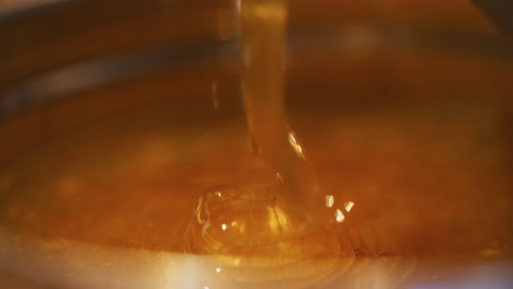 cone of thick flowing golden honey