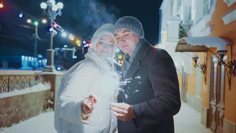 couple celebrating new year's eve in the snow