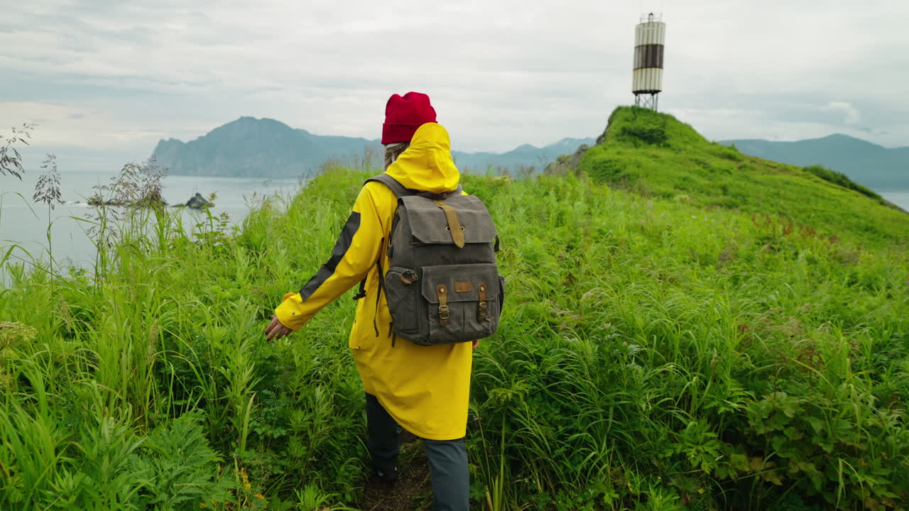 Woman Hiking on a Coastal Trail