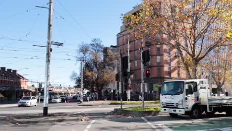 vehicles and pedestrians at a city intersection