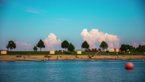 Summer-fun-on-the-beach-of-a-sea-or-lake---time-lapse