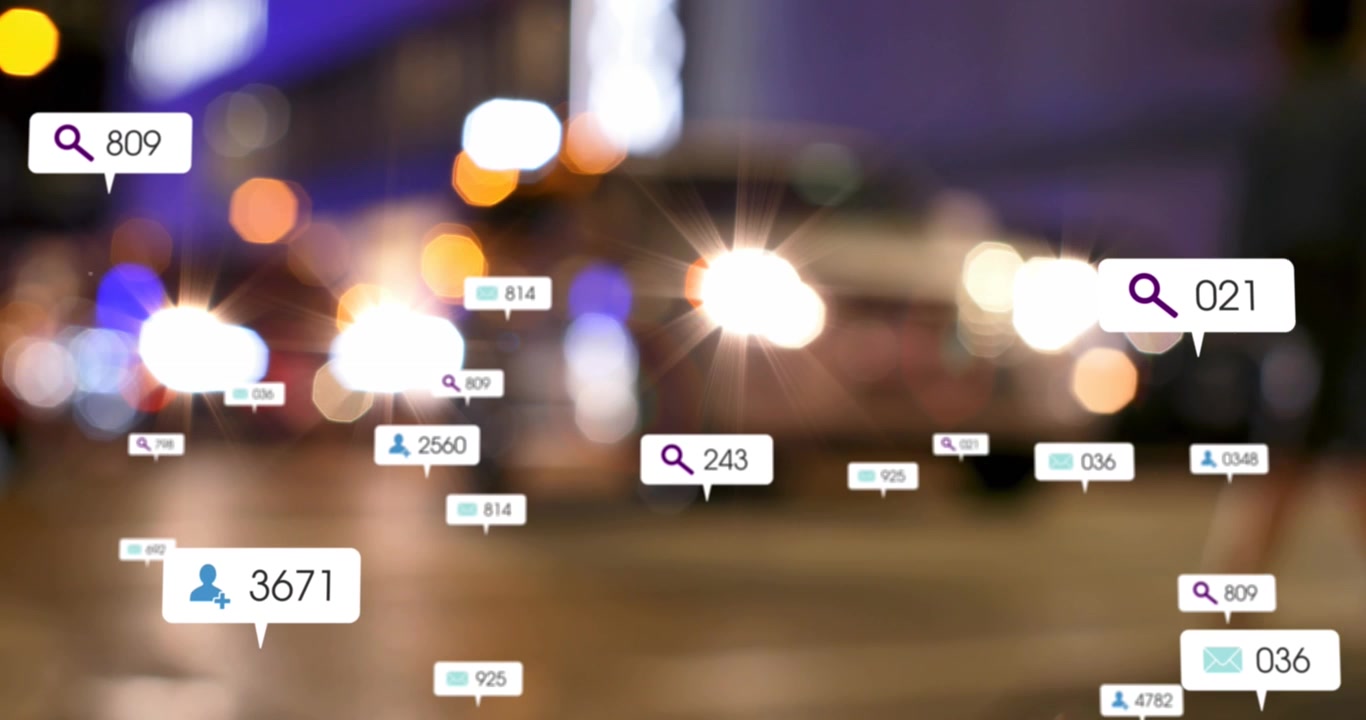 Animation of social media icons and numbers over out of focus city and traffic lights