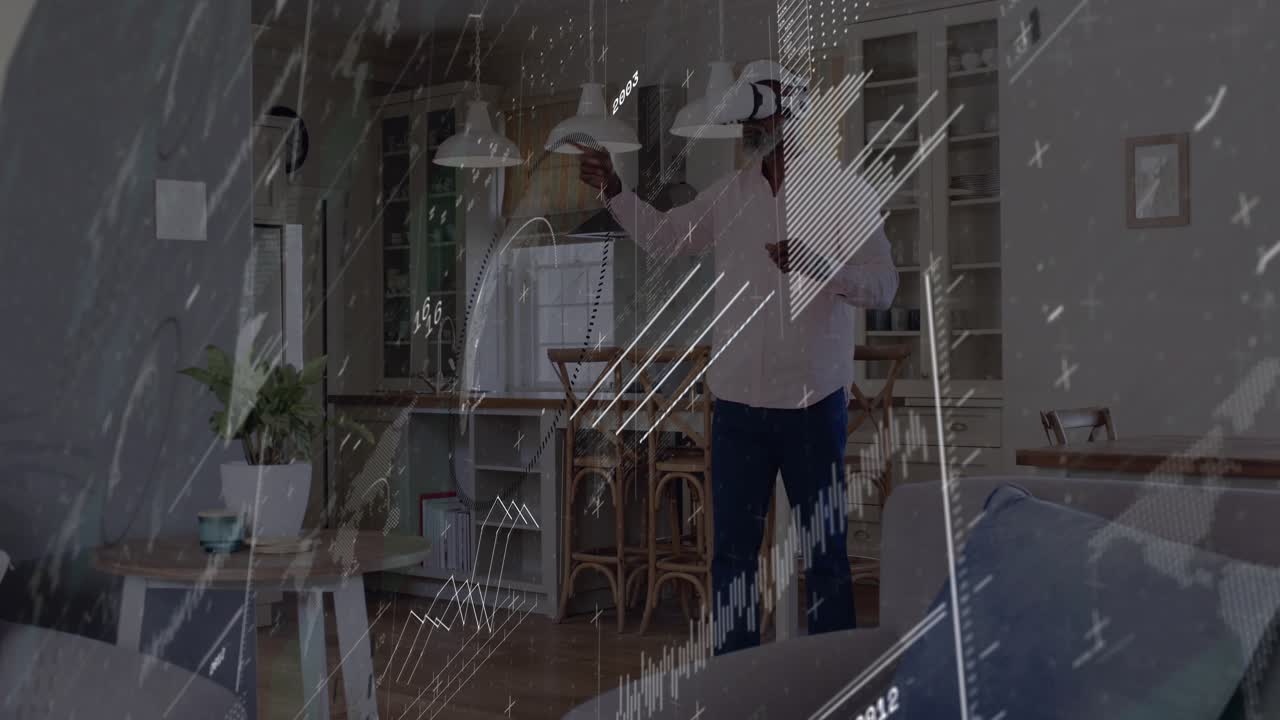 Mature man wearing VR headset raising right hand, summoning holographic charts for data analysis