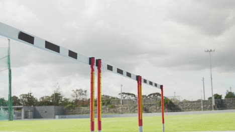 side view of african american athlete doing hurdling