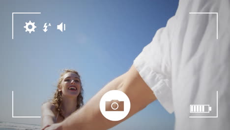 tomando fotos de una pareja con una cámara digital