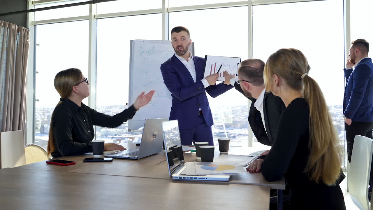 Business discussion between partners in office. Teamwork of successful colleagues in business centre. Man leader sharing his new ideas to business people.